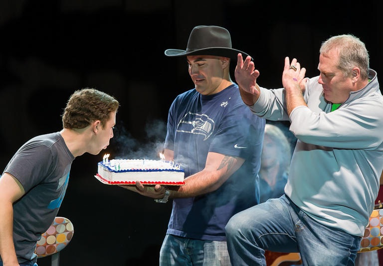 SCOTTY McCREERY IS SURPRISED ON STAGE BY RETIRED NFL SEATTLE SEAHAWKS WITH A BIRTHDAY CAKE. (PRESS RELEASE)