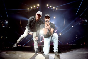 NASHVILLE, TN - MAY 06:  Singer-songwriters Cole Swindell (L) and Luke Bryan (R) perform on stage and Kicks off the "Huntin', Fishin' And Lovin' Every Day" Tour at Bridgestone Arena on May 6, 2017 in Nashville, Tennessee.  (Photo by John Shearer/Getty Images for Schmidt PR) *** Local Caption *** Luke Bryan;Cole Swindell
